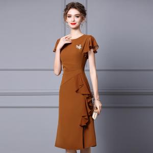 Medium length women's dress with thin waist and ruffle edge